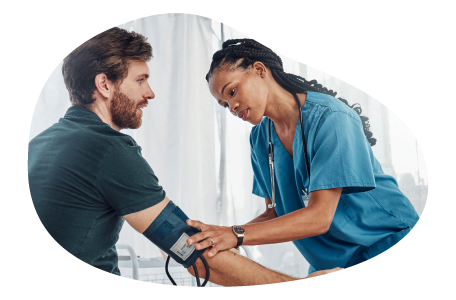 A medical assistant takes a patient's blood pressure. A medical assistant takes a patient's blood pressure.