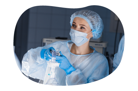 A nurse anesthetist (CRNA) administers anesthesia to a patient.