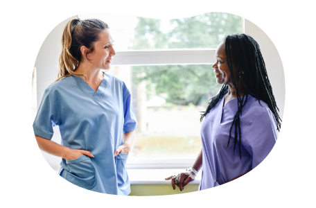 A nurse practitioner speaks with a patient. A nurse practitioner speaks with a patient.