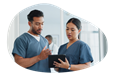 Nurse reviewing a medical chart with a colleague.