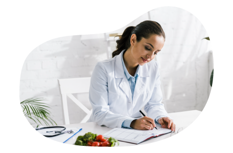 Nutritionist writing a dietary plan.