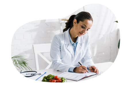 Nutritionist writing a dietary plan. Nutritionist writing a dietary plan.