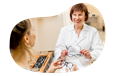 Optician testing glasses with a patient.