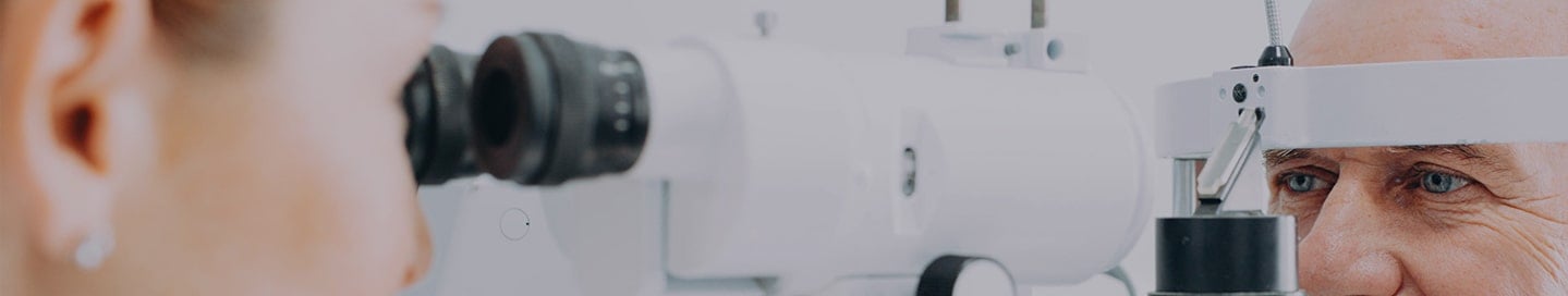 Optometrist checking patient eyesight and vision correction Optometrist checking patient eyesight and vision correction