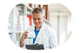 A pharmacist looks over a patient's prescription.