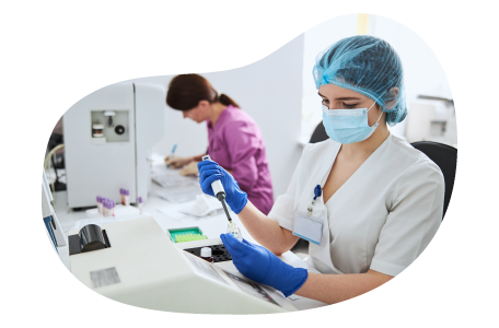 Phlebotomist testing a blood sample.