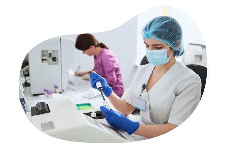 Phlebotomist testing a blood sample. Phlebotomist testing a blood sample.