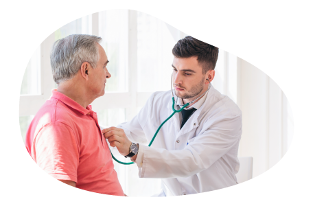 A respiratory therapist listens to a patient's breathing.