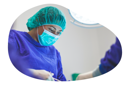 A surgeon working on a patient in a hospital.