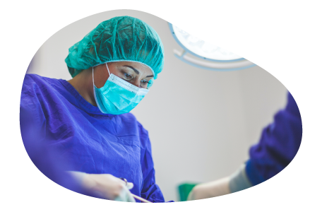 A surgeon working on a patient in a hospital. A surgeon working on a patient in a hospital.