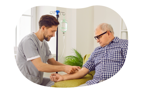 A travel nurse sets up an IV line for a patient.