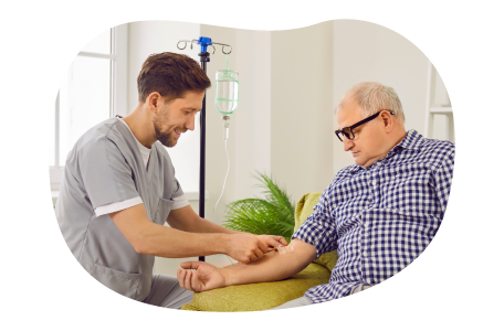 A travel nurse sets up an IV line for a patient. A travel nurse sets up an IV line for a patient.