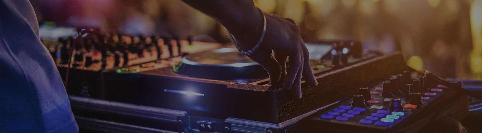 Dj on stage working a turn table. Dj on stage working a turn table.