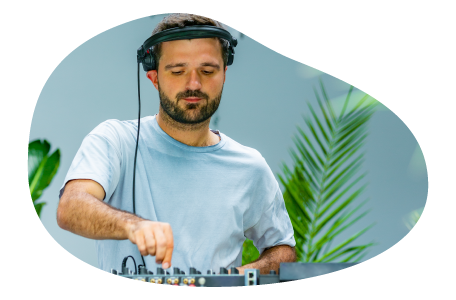 Disc jockey playing music at an event.