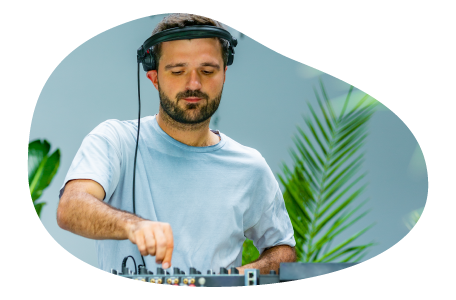 Disc jockey playing music at an event.