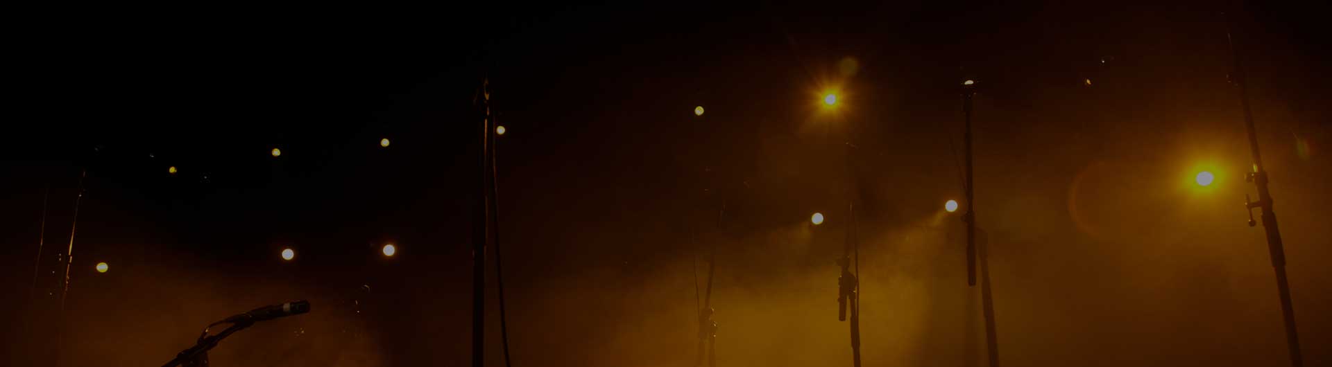 Empty stage with microphones.