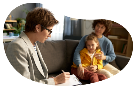 Adoption agency employee speaking with a family.