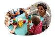 Daycare center employee playing with children.