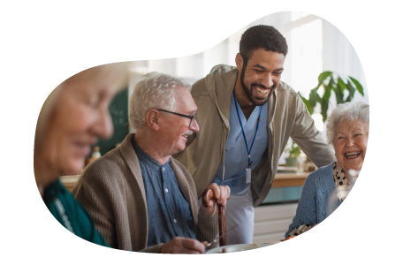 Group home employee taking care of residents. Group home employee taking care of residents.