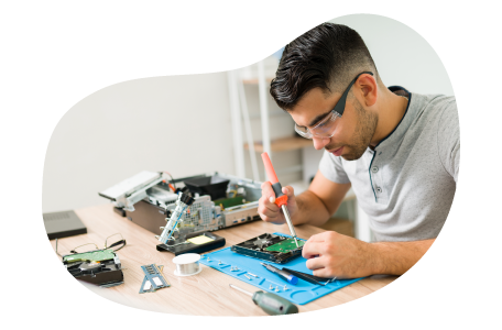 Computer repair tech fixing computer parts. Computer repair tech fixing computer parts.