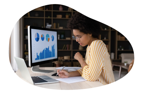 Data analyst examining trends on a computer.