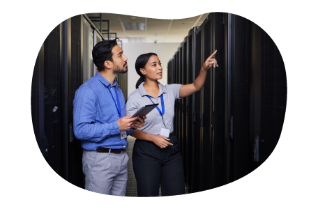 Tech experts evaluate data center equipment. Tech experts evaluate data center equipment.