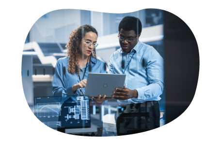 Data scientists reviewing findings on a laptop. Data scientists reviewing findings on a laptop.