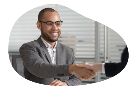 IT staffing agency employee shaking hands with a client.