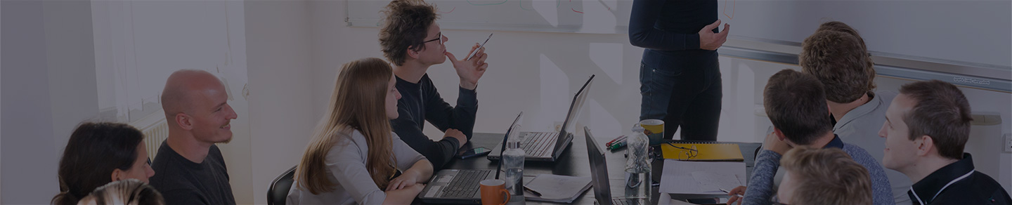 An IT trainer providing instruction to a client's team