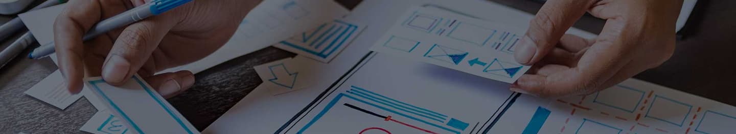 Mobile app developer sketching a prototype.