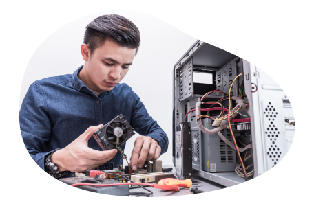 An employee at a PC building business assembles a computer. An employee at a PC building business assembles a computer.
