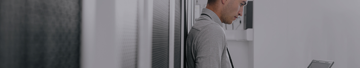 SaaS company employee working on a laptop.