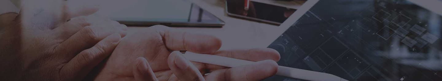 Web designer pointing to a prototype on an iPad. Web designer pointing to a prototype on an iPad.