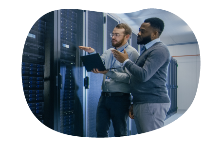 Web hosting technicians looking at web mainframe.