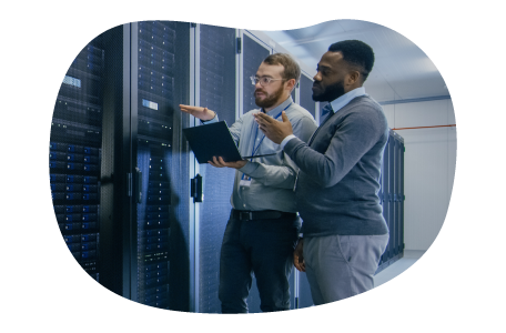 Web hosting technicians looking at web mainframe. Web hosting technicians looking at web mainframe.