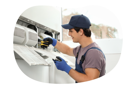 Appliance installation professional connecting appliance wiring.