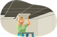 Man installing ceiling tiles.