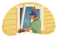 Person in gloves and hat installing a window on a home.