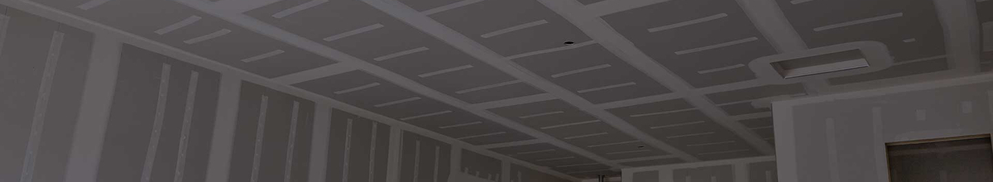 Open room with completed drywall.