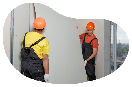 Contractors installing drywall into a building.