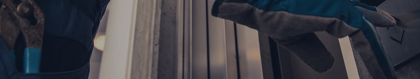 A contractor tests the call buttons on a newly installed elevator. A contractor tests the call buttons on a newly installed elevator.