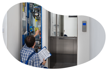 A technician configures the controls on a newly installed elevator. A technician configures the controls on a newly installed elevator.