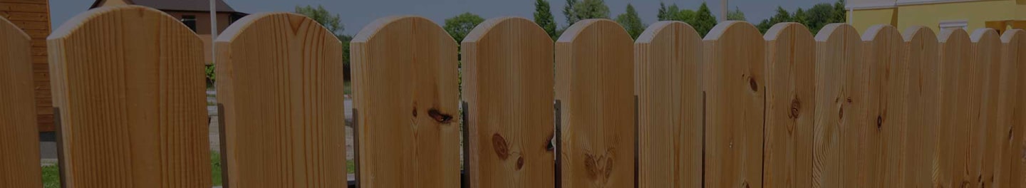 New fence installed in a yard. New fence installed in a yard.