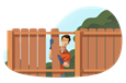 Man installing wood fencing in a backyard.