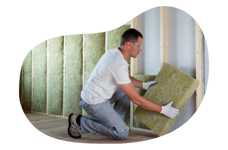A contractor installs wall insulation in a client's home.