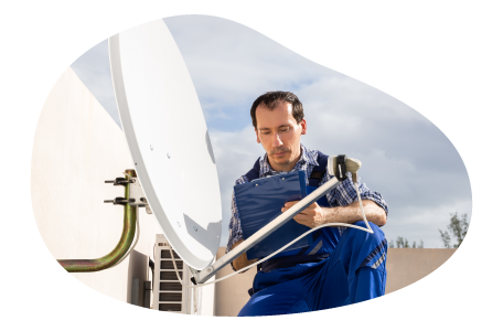 A contractor installs a new satellite dish. A contractor installs a new satellite dish.