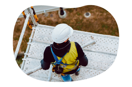 A scaffolding contractor working on a platform. A scaffolding contractor working on a platform.