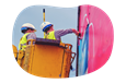 Sign installers in a boom lift painting a billboard.