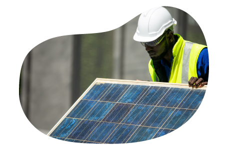 A contractor installs a new solar panel.