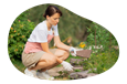 Landscaping designer setting stones on a client's property.